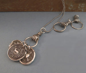 talisman, hand charm holder